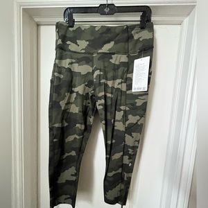 Brand new w/tags. LULULEMON Fast Free HR Crop 23’ with pockets. Size 12.